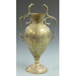 Cairo ware brass vase with engraved winged figures and serpent handles, 55cm tall