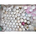 Approximately 70 novelty egg cups including nursery ware, Beatrix Potter, souvenir ware etc
