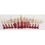 A 19thC/early 20thC Chinese carved ivory part chess set, one side stained red, height of king