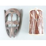 A 19th/20thC carved African tribal mask and a similar drum