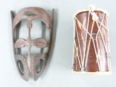 A 19th/20thC carved African tribal mask and a similar drum