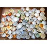 Approximately 60 novelty egg cups, mostly Japanese / foreign, kitsch and retro examples