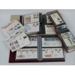 A large collection of GB, Channel Island and Isle of Man first day covers, loose and in four albums