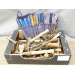 A collection of woodworking tools including planes, chisels, folding rulers etc