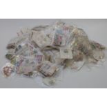A substantial quantity of Commonwealth and foreign stamps in plastic bags together with four penny