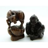 Japanese erotic netsuke and another netsuke depicting a water buffalo, both signed