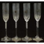 A set of eight Rosenthal Studio-Line champagne flutes with bobbled stems, 27cm tall