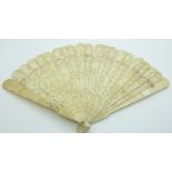A 19thC Chinese ivory brise fan carved with court scenes, 18.5cm