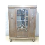 A 19thC glazed twin door display cabinet with adjustable shelves, raised on cabriole legs, W131 x