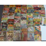 Sixty-two Dell comics comprising including The Young Lawyers, Daniel Boone, Charlie Chan, Smokey The