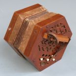 Early to mid 20thC Anglo German 21 key concertina with wooden fretworked ends and five fold