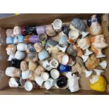Approximately 40 mostly figural egg cups mostly Barstow Manor including Spitting Image, Goebel etc