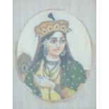 A 19thC Indian ivory portrait miniature of a lady with head dress, 8 x 6cm