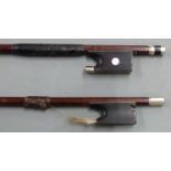 Tourte violin bow with octagonal stick, ebony frog with mother of pearl eye and three part silver