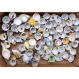 Approximately 60 novelty egg cups including figural, retro, kitsch, Japanese etc