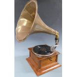 Horn gramophone with brass horn and Gilbert and Sullivan 78rpm records in a folder