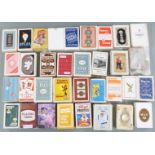 Approximately 35 single packs of advertising playing cards, shipping etc