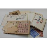 Four albums and a folder of GB and all-world stamps including large blocks of GB 1940 centenary