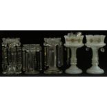 Two pairs of Victorian glass lustre vases, one pair opaline the other clear, together with another