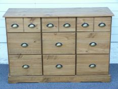 Pine chest of nine drawers with brass handles, W118 x D40cm x H90cm