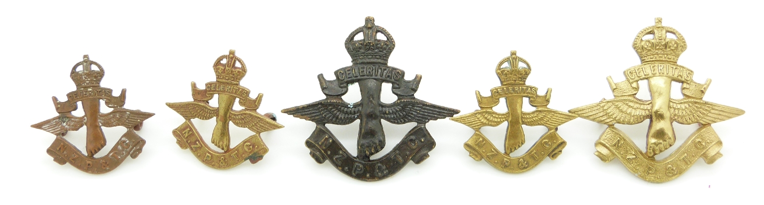 New Zealand Territorial Force Post and Telegraph Corps metal hat and collar badges, three with Gaunt