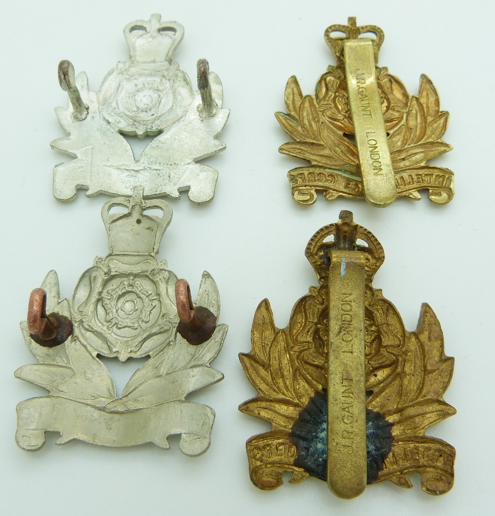 Seven British Army Intelligence Corps metal cap badges including a ...