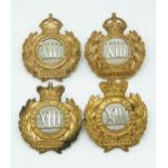 Four British Army 13th Hussars metal badges with Imperial and Queen's crowns