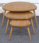 Ercol nest of three light elm pebble tables with visible joints, largest 40 x 66 x 46cm