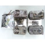 Four trail cameras comprising two Apeman and two Ltl Acorn, with instructions, tripods etc