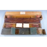 A collection of approximately 31 vintage archery arrows, in three wooden cases including Thomas