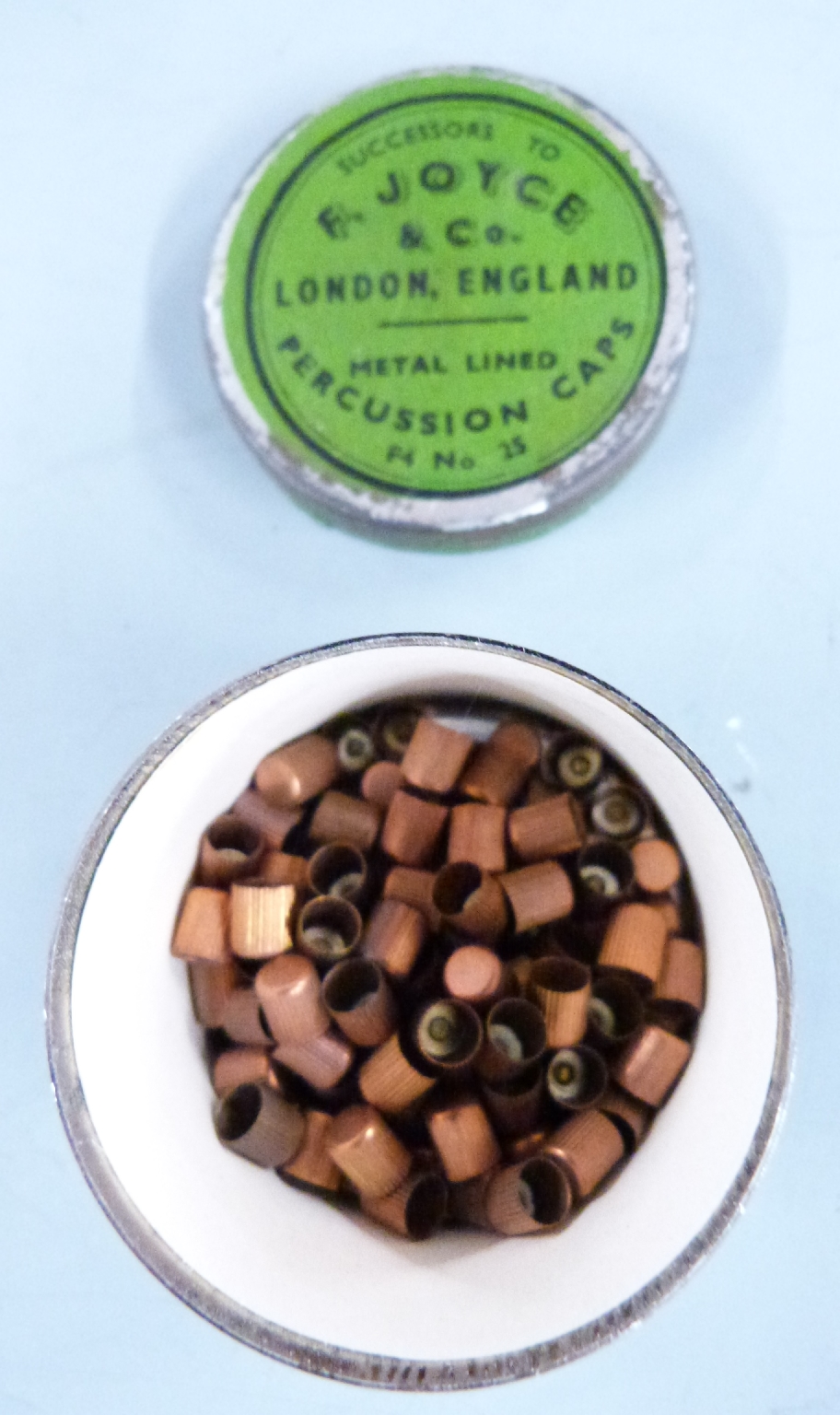 Five various percussion cap tins comprising a turned bone pair, a ...