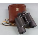 A pair of Carl Zeiss Jena Jenoptem 10x50w binoculars, in leather case