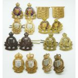 Sixteen British Army Royal Ordnance Corps metal collar badges in five pairs plus six, two by J R