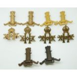 Ten British Army 11th and 20th Hussars metal collar badges in four pairs plus two, one with J R