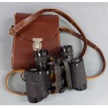 A pair of Carl Zeiss Jena Jenoptem 8x30w binoculars in leather case