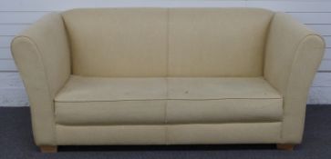 Cream upholstered sofa