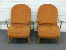Ercol pair of light elm low back armchairs, H90cm