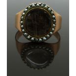 Georgian / Victorian mourning ring set with plaited hair in a glass compartment surrounded by seed