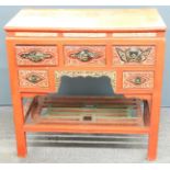 Oriental red lacquer desk with carved and pierced decoration highlighted in gilt and painted