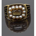 Georgian mourning ring set with plaited hair to the centre surrounded by seed pearls and decorated