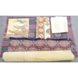 Five large modern rugs and wall hangings, including three large geometric pattern rugs and a wall