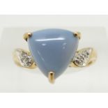 A 9ct gold ring set with a trilliant cut blue fire opal cabochon and diamonds, 2.9g, size N