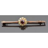 A 9ct gold brooch set with a garnet and seed pearls, 2.5g, 5cm