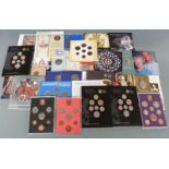 Nine largely Royal Mint coin sets including proof and brilliant uncirculated Royal Shield of Arms