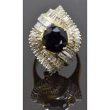 An 18ct gold metamorphic ring / pendant set with a round cut sapphire of approximately 2.2ct