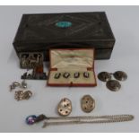 A pair of silver and enamel cufflinks, The Goldsmiths and Company box, silver brooches, pair of