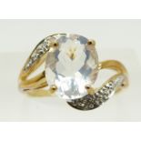 A 9ct gold ring set with an oval cut ice opal and diamonds, 2.8g, size M