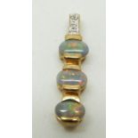 A 9ct gold ring set with three black opal cabochons and diamonds, 1.8g weight of pendant 1.7g