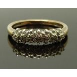 A 9ct gold half eternity ring set with diamonds, size P, 2.7g