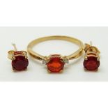 A 9ct gold ring set with a round cut Salamanca fire opal and diamonds (size N) and a pair of 9ct